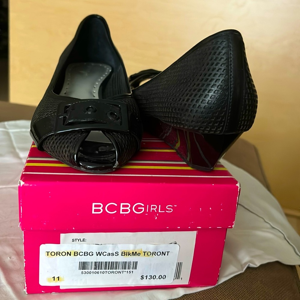 Practically brand new. Wedge style heel.